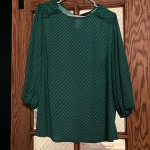 Green and white polka dot blouse